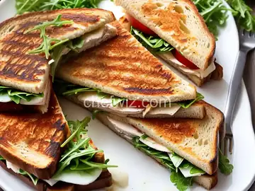 Grilled Turkey, Brie, and Apple Butter Sandwich with Arugula