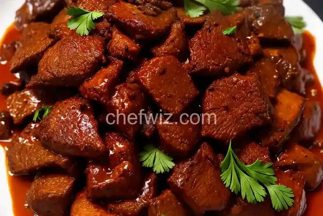 Asun (spicy roasted goat meat)
