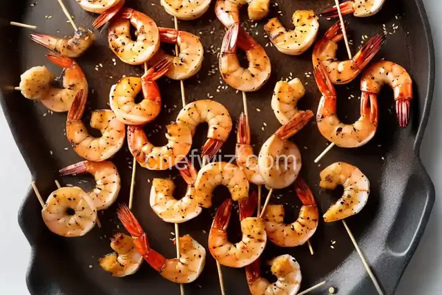 Grilled Shrimp Skewers with Soy Sauce, Fresh Ginger and Toasted Sesame Seeds